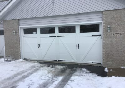 Clopay white barn style garage door installation in Illinois