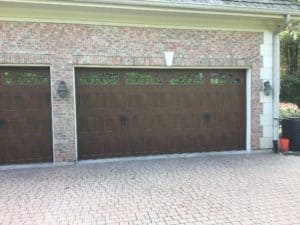 Clopay garage door with brown wood panels.