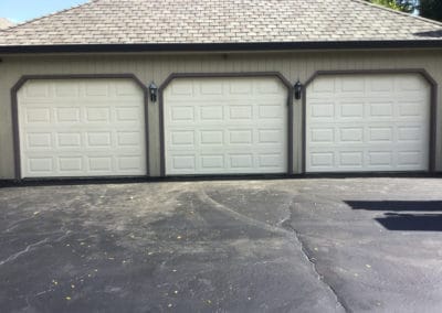 Clopay beige three car garage door installation in Illinois