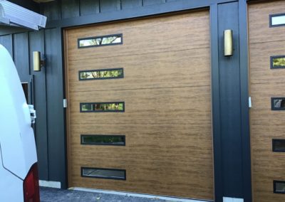 Clopay Garage wooden garage door with vertical windows installation in Illinois