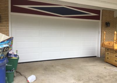Clopay white double garage door installation in Naperville, Illinois