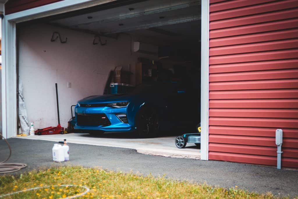 blue car in garage