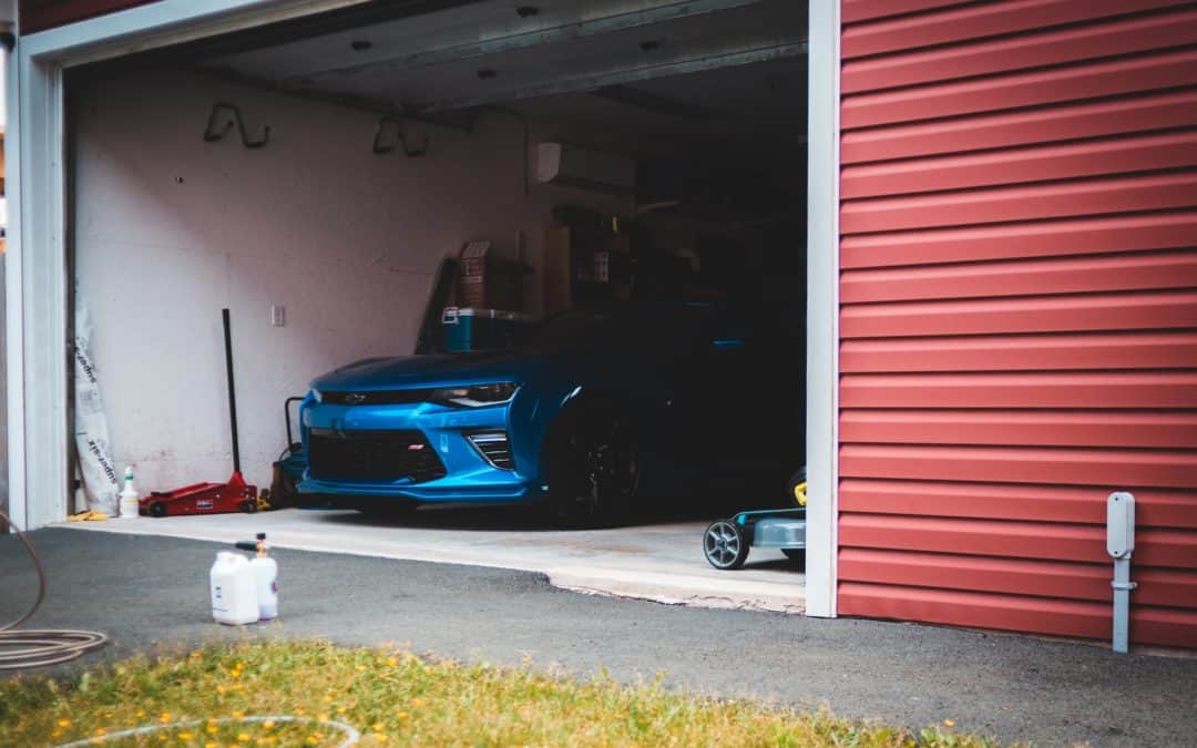 blue car in garage