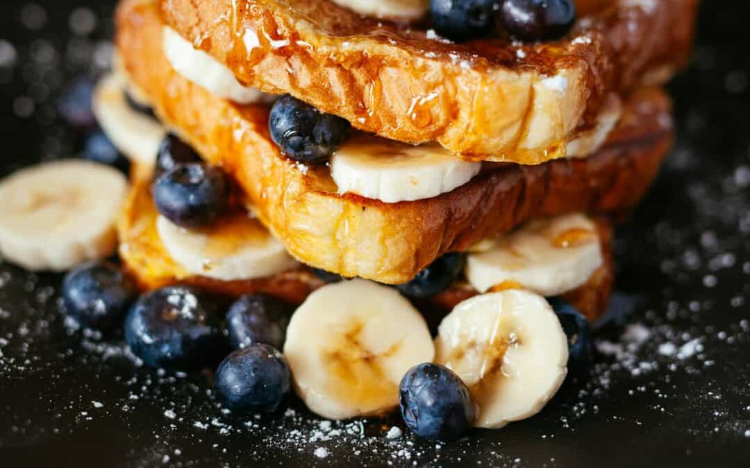 French toast covered in berries at a breakfast restaurant