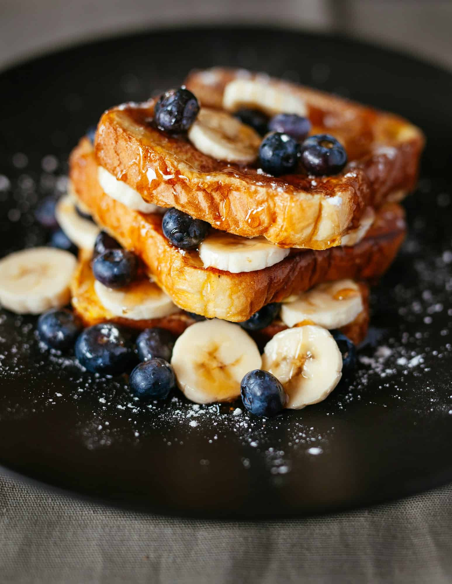 French toast covered in berries at a breakfast restaurant